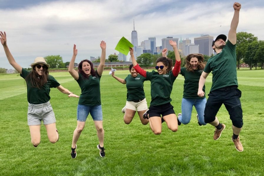 People Jumping on a scavenger hunt in New York City.