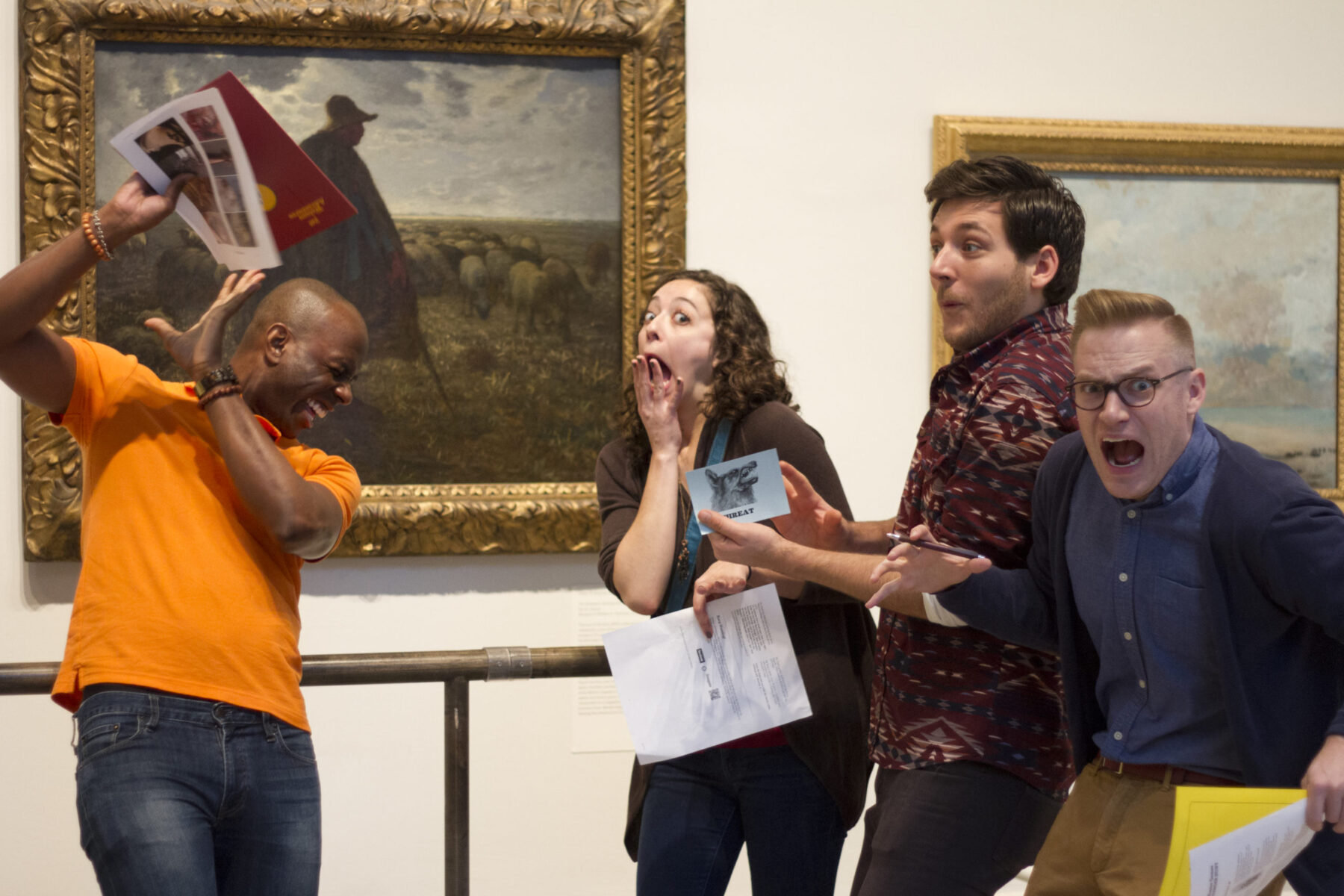 A team building group on a murder mystery scavenger hunt at an art museum
